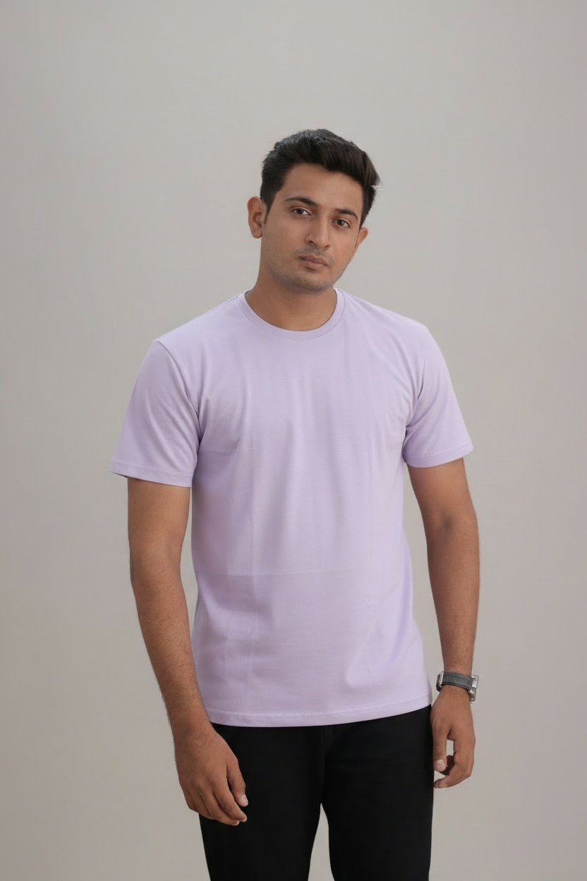 Man wearing a lavender t-shirt against a plain background